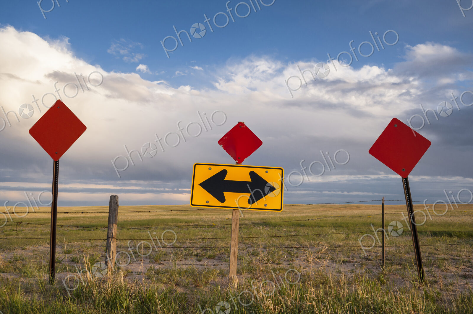 Traffic sign in remote field under clouds