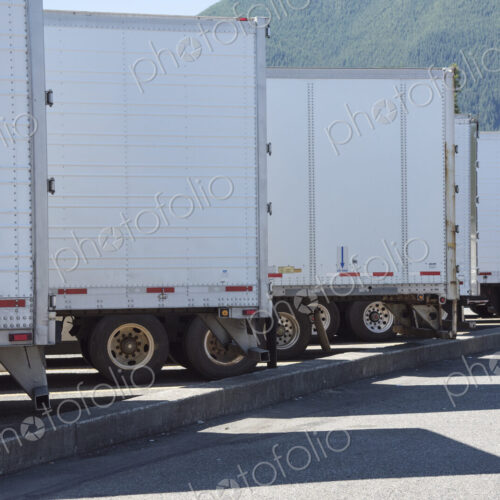 Trailers lined up in a truck stop parking lot. Trailers lined up in a truck stop parking lot.