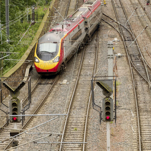 Train changing tracks at junction on railway tracks.