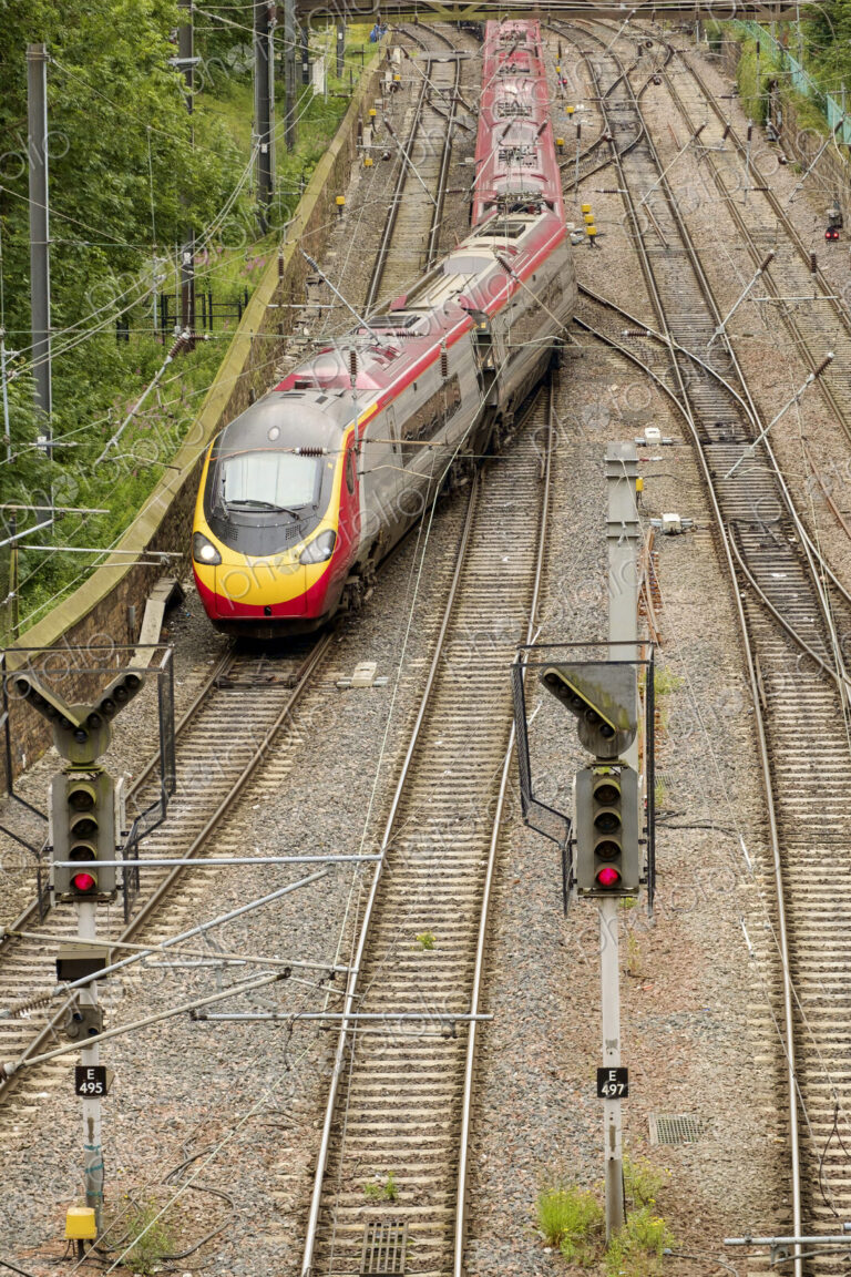 Train changing tracks at junction on railway tracks.