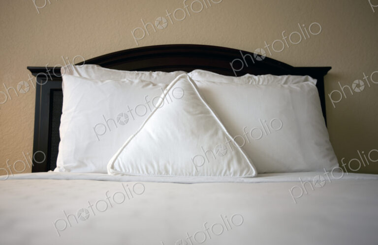 Triangle pillow on bed