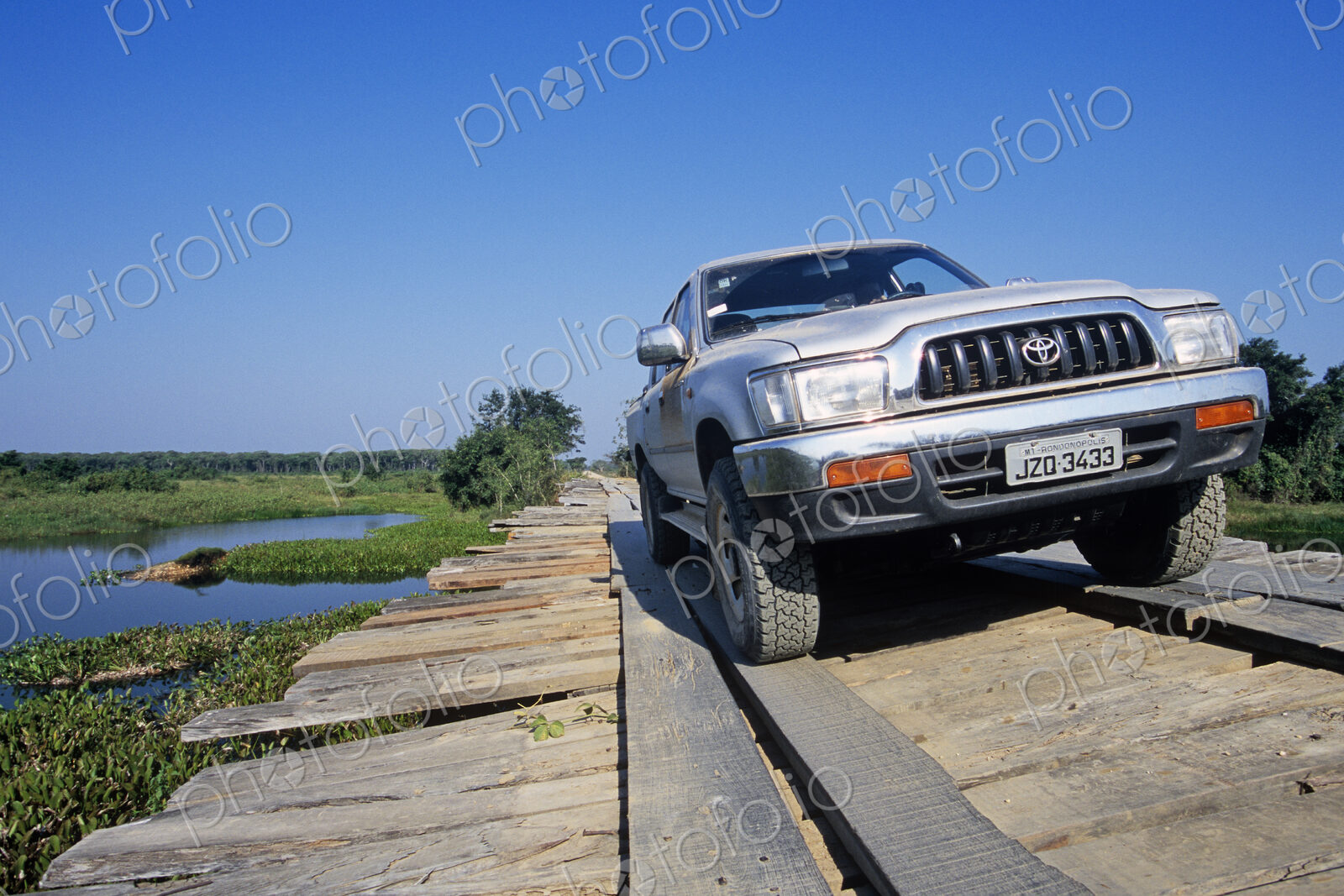 Truck Crossing Old Wooden Bridge