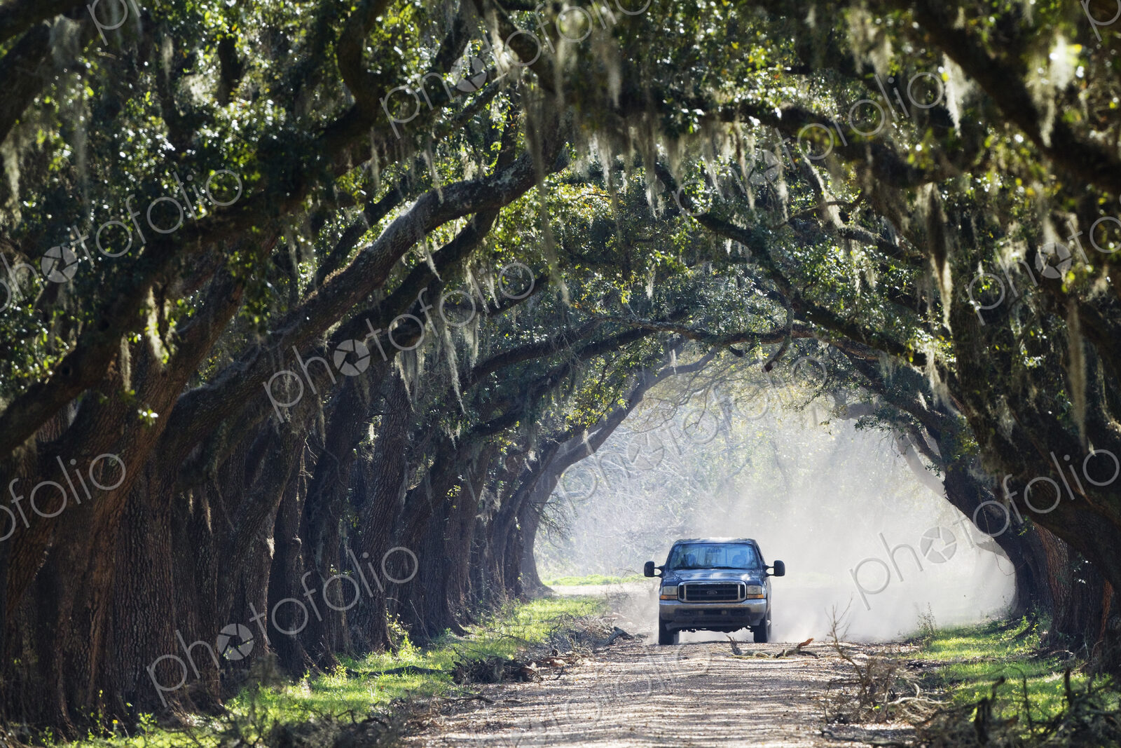 Truck Driving Down Dirt Road