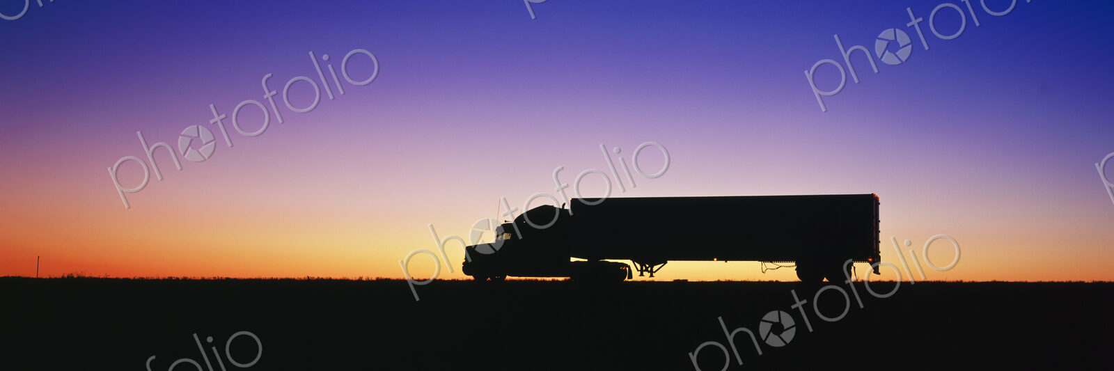 Truck Parked on Freeway at Sunrise