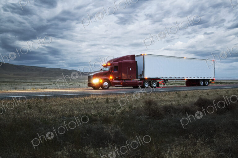Truck on a highway through the grasslands area of eastern Washington, USA.