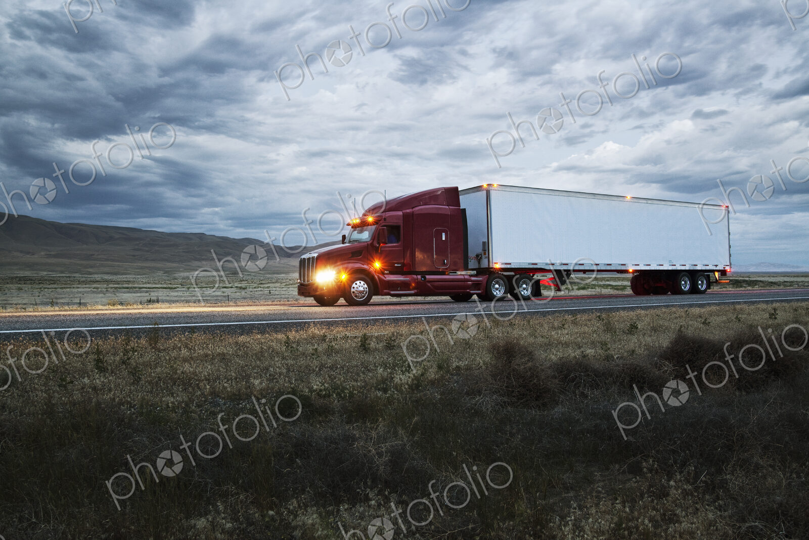 Truck on a highway through the grasslands area of eastern Washington, USA.