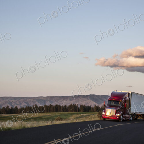 Truck on a highway through the grasslands area of eastern Washington, USA.