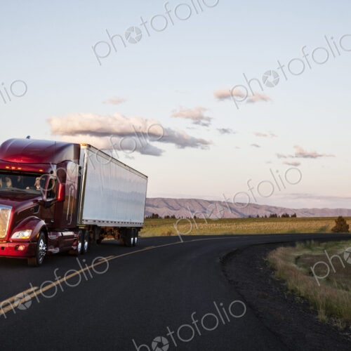 Truck on a highway through the grasslands area of eastern Washington, USA.