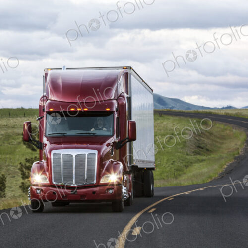 Truck on a highway through the grasslands area of eastern Washington, USA.