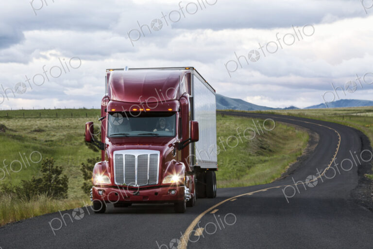 Truck on a highway through the grasslands area of eastern Washington, USA.