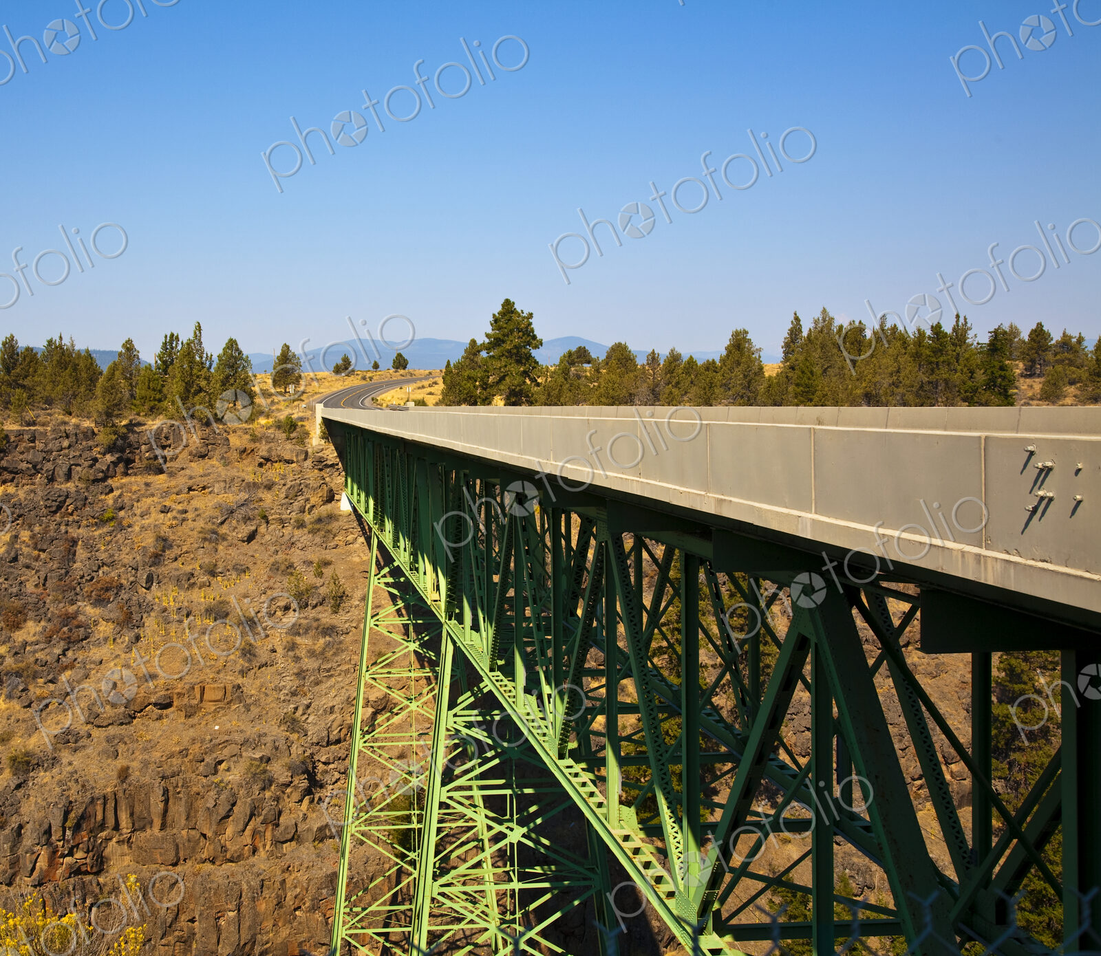 Truss Bridge and Rocky Cliff Face
