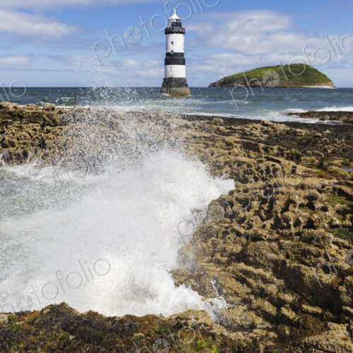 Trwyn Du Lighthouse, a lighthouse built at Penmon in the 1830s, black and white tower. Trwyn Du Lighthouse, a lighthouse built at Penmon in the 1830s, black and white tower.