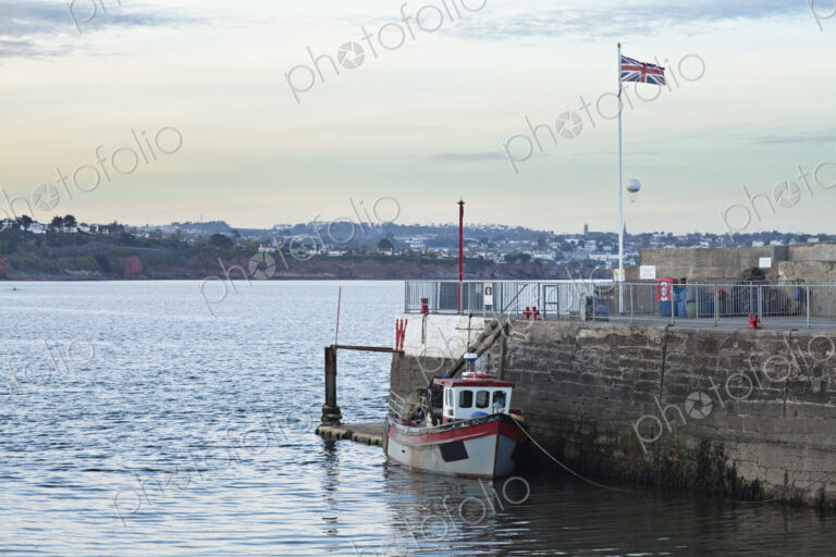 Tugboat Docked on Water