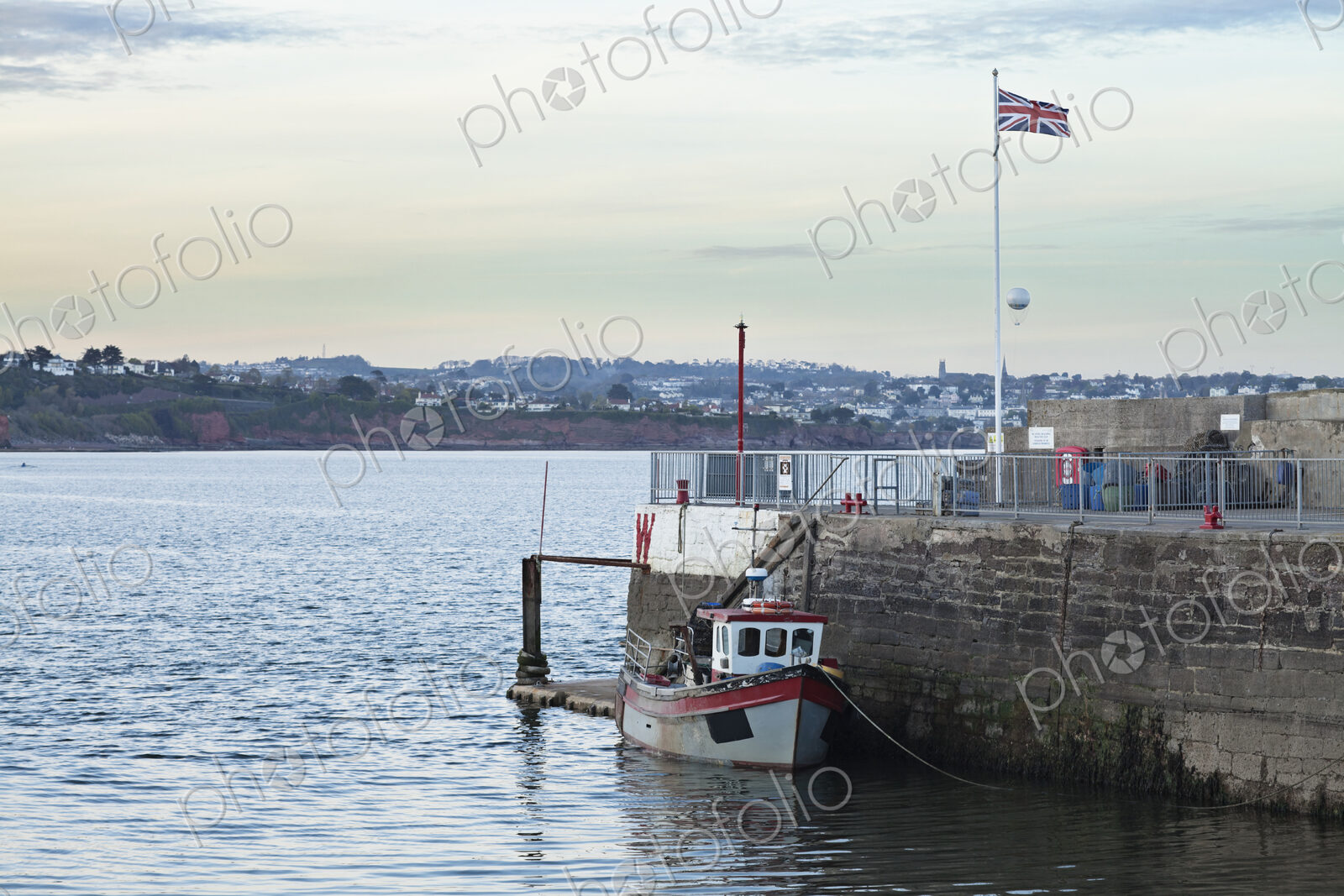 Tugboat Docked on Water