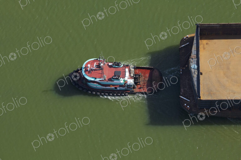 Tugboat Pulling a Barge