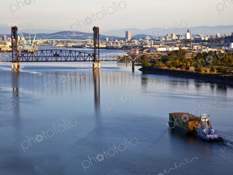 Tugboat Pushing Barge in River