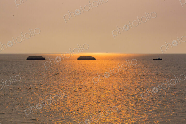 Tugboat hauling two sand barges, Strait of Juan de Fuca.