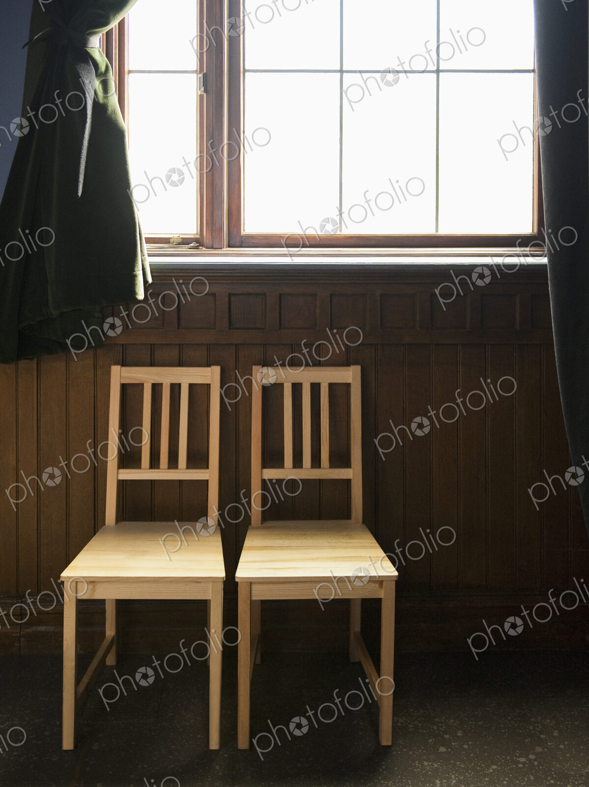Two Empty Chairs Beneath a Window