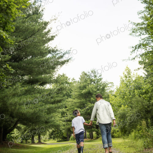 Two brothers walking on a country path.