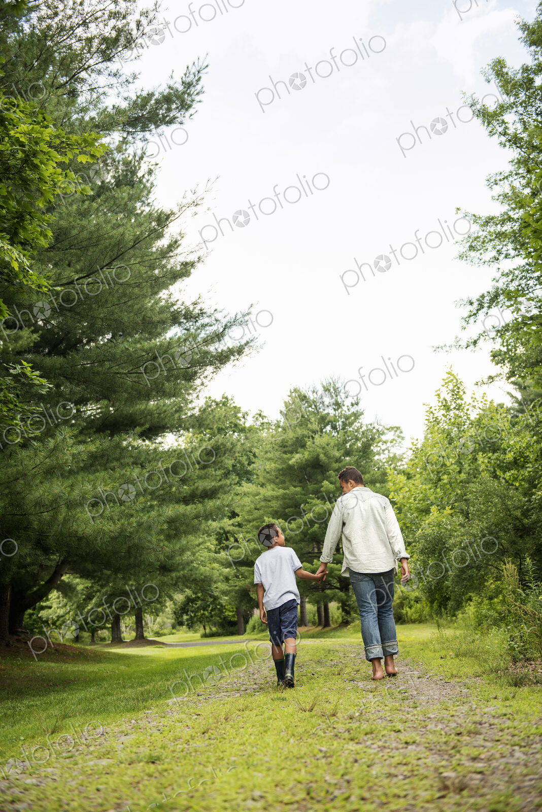 Two brothers walking on a country path.