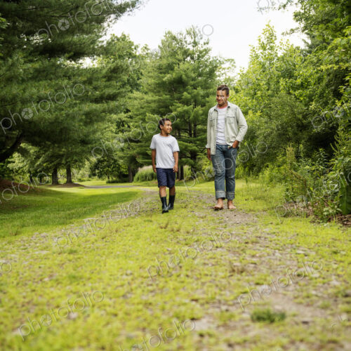 Two brothers walking on a country path.