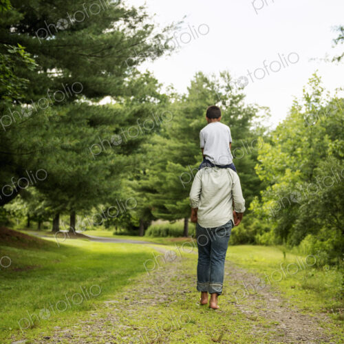 Two brothers walking on a country path.