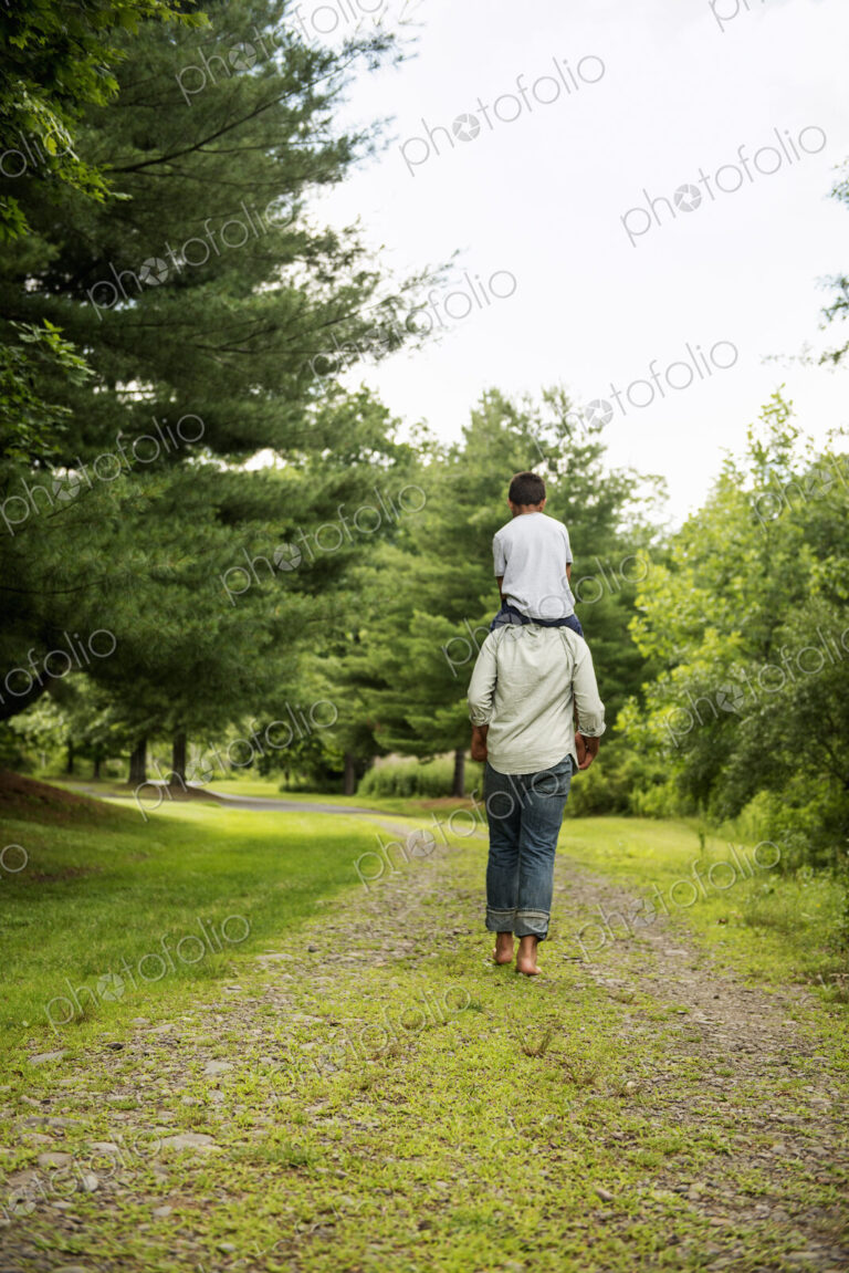 Two brothers walking on a country path.