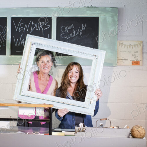 Two caucasian women onwers of an antique store. Two caucasian women onwers of an antique store.