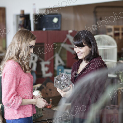 Two caucasian women shopping in an antique store Two caucasian women shopping in an antique store