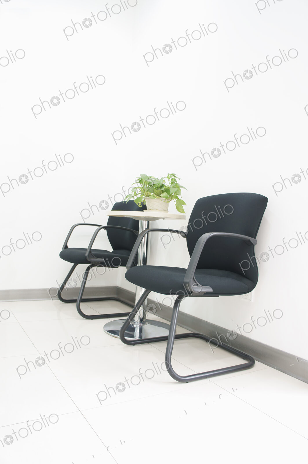 Two chairs and a table in an office