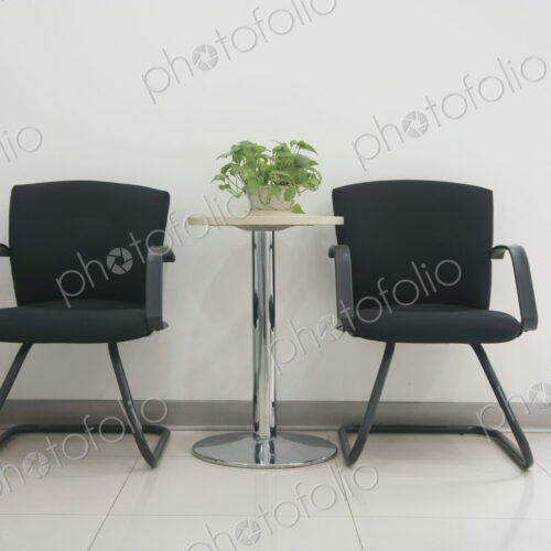 Two chairs in an office.