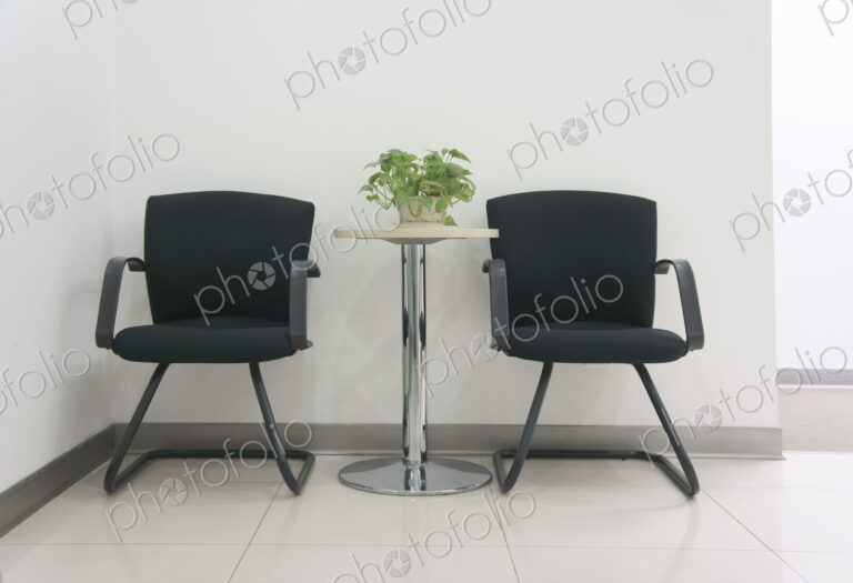 Two chairs in an office.