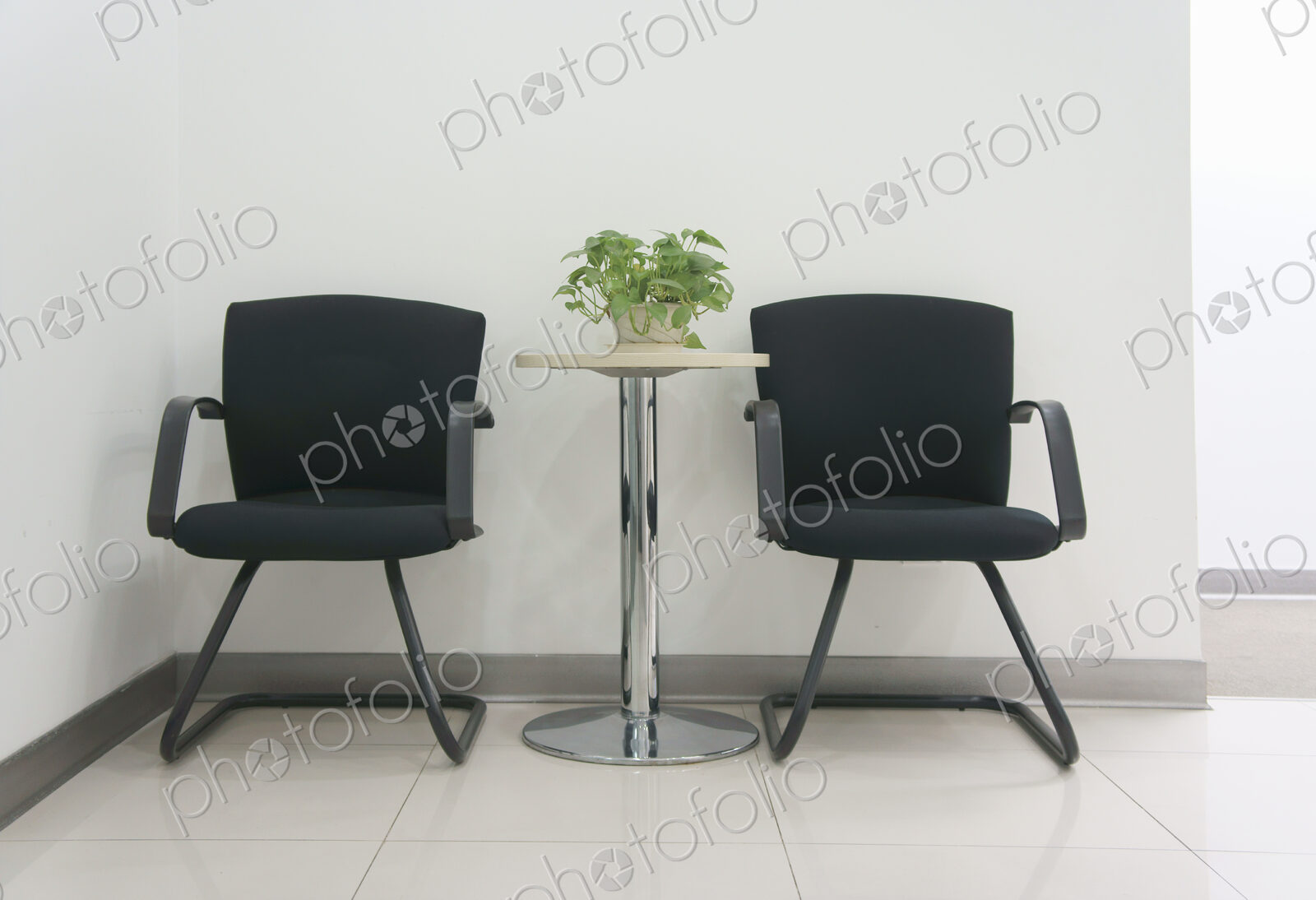Two chairs in an office.