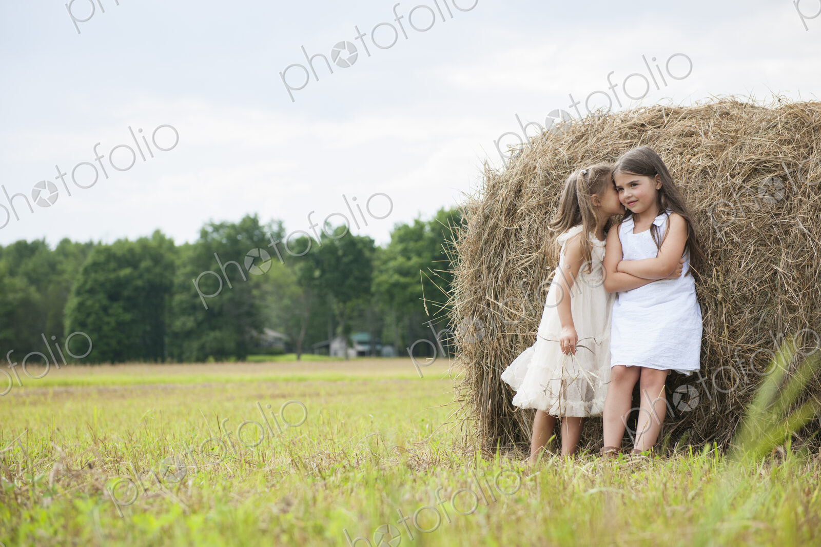 Two girls playing outdoors.