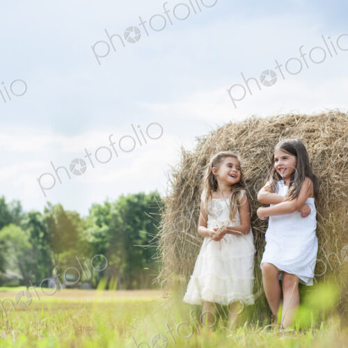 Two girls playing outdoors. Two girls playing outdoors.