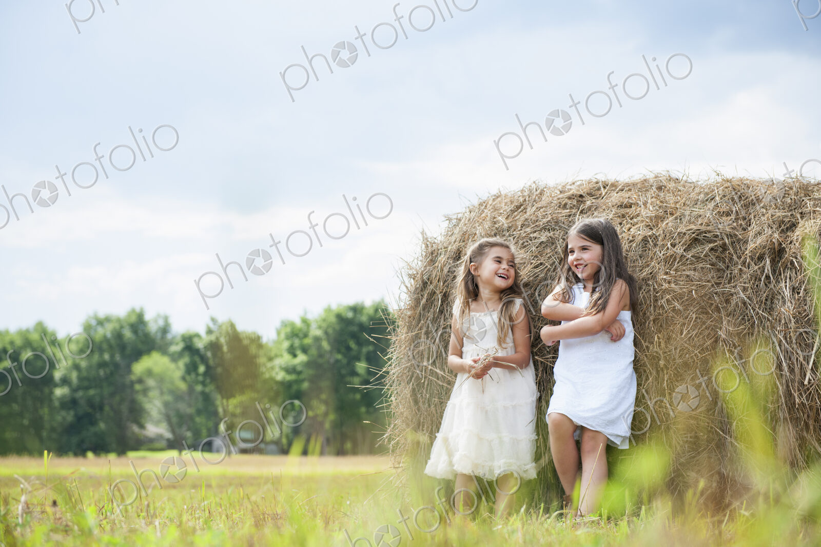 Two girls playing outdoors.