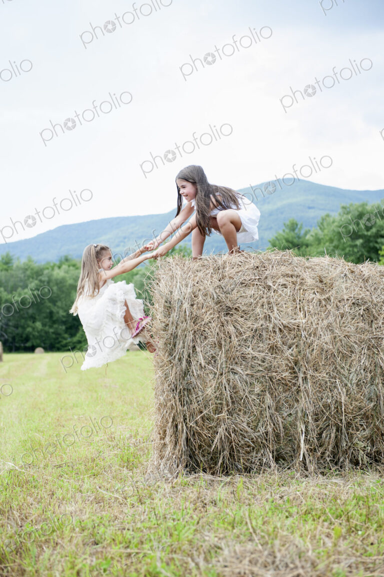 Two girls playing outdoors.