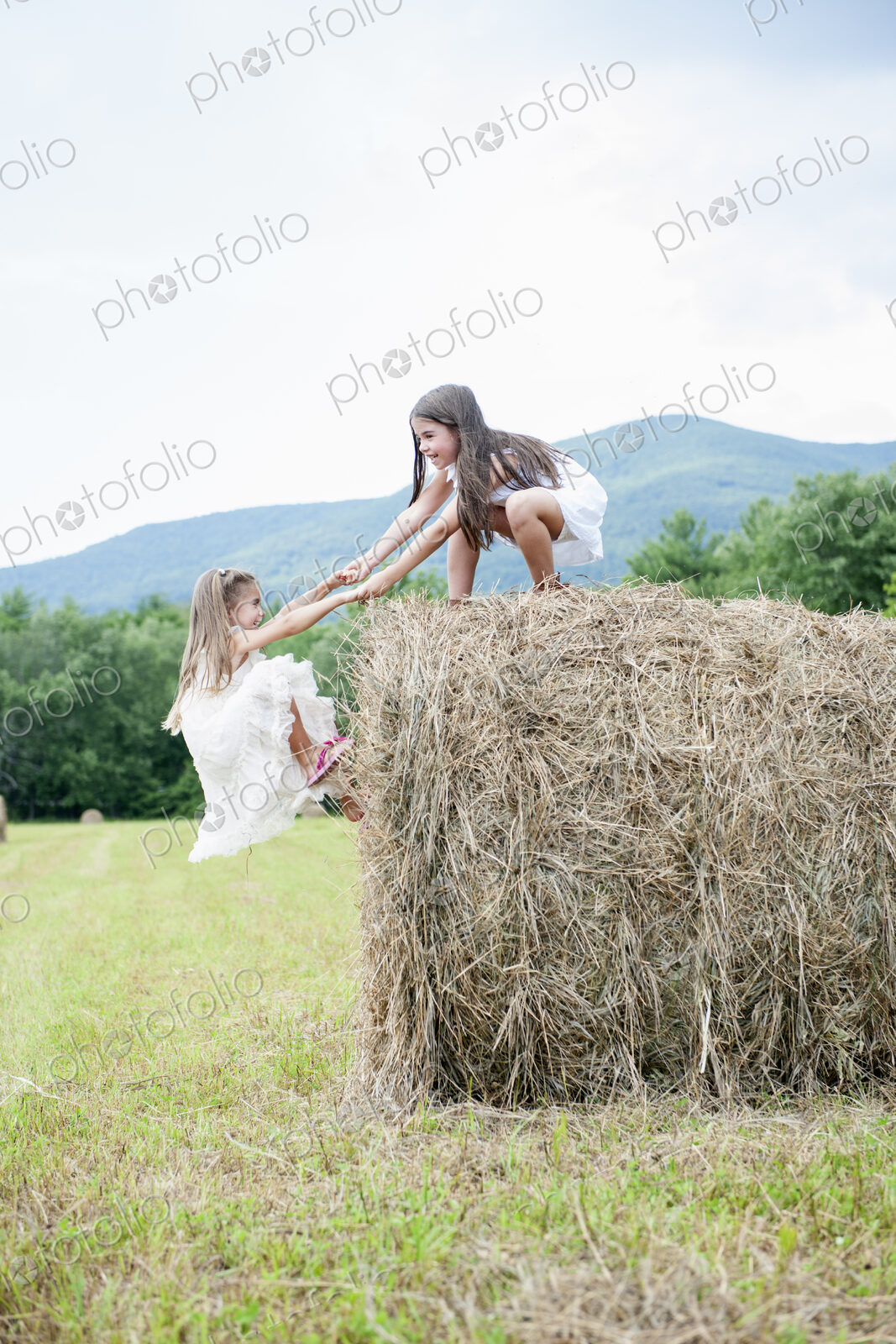 Two girls playing outdoors.