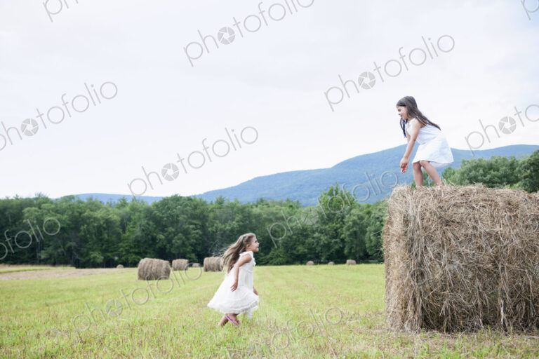 Two girls playing outdoors.