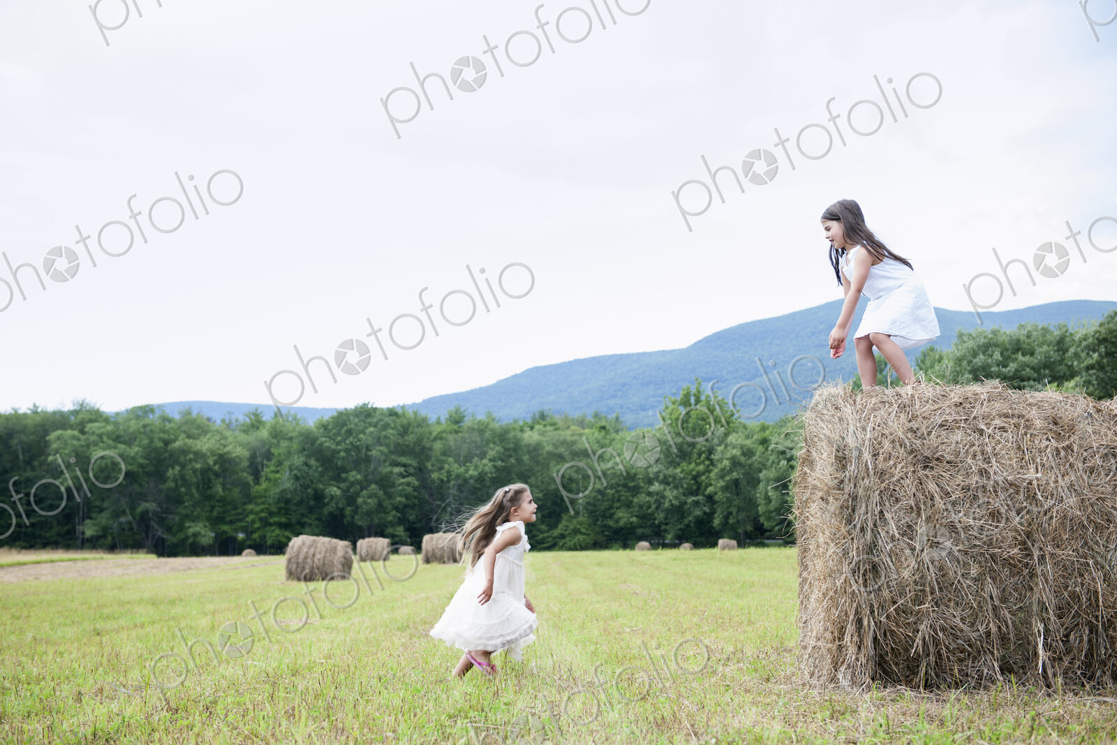 Two girls playing outdoors.