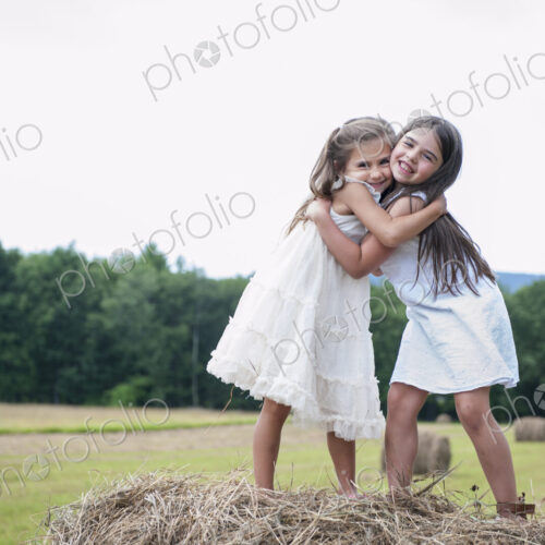 Two girls playing outdoors.