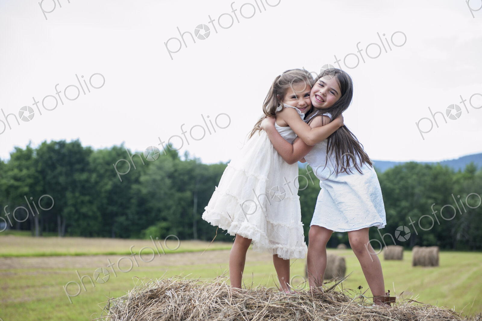 Two girls playing outdoors.