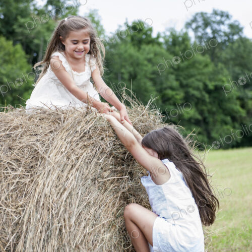 Two girls playing outdoors. Two girls playing outdoors.