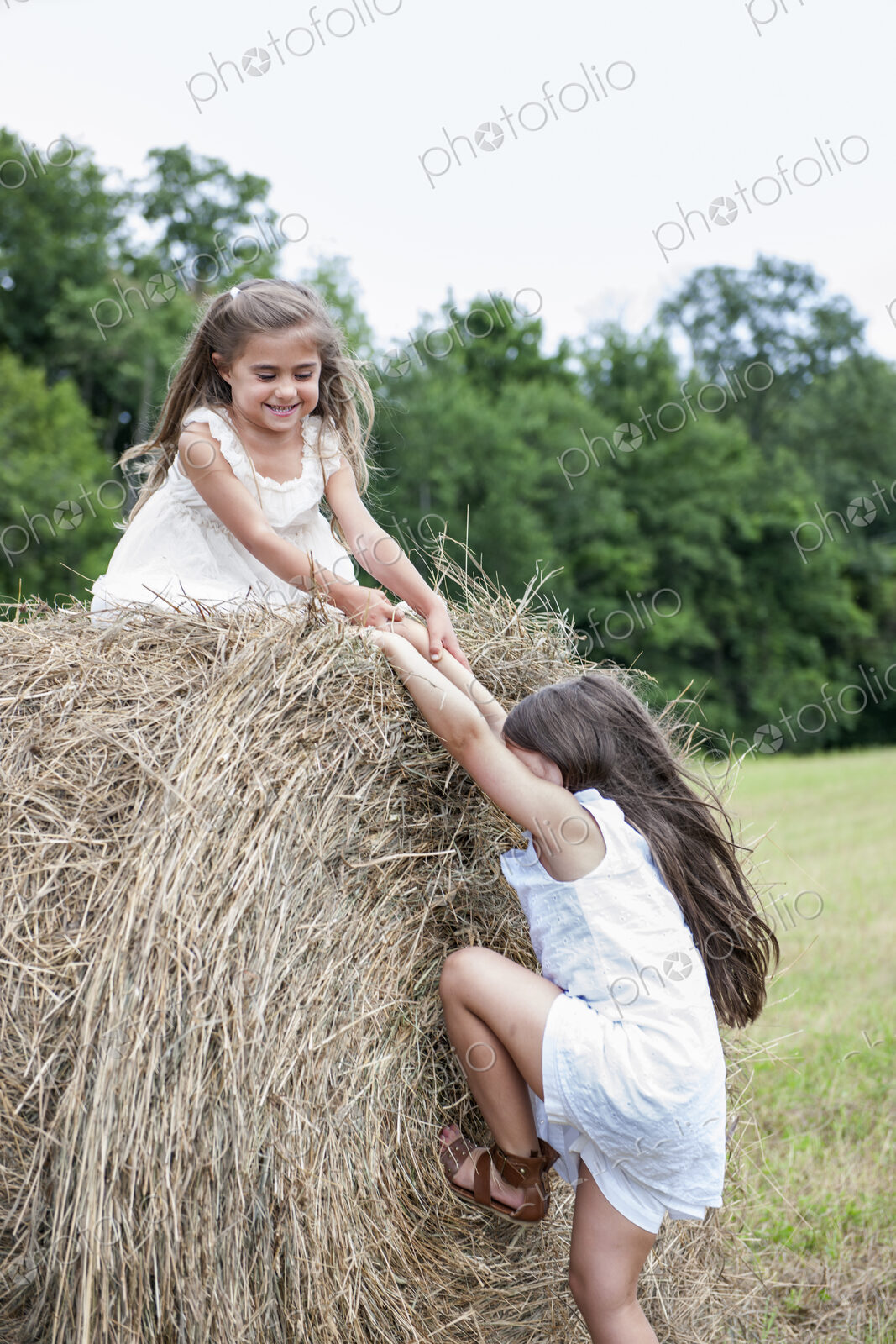 Two girls playing outdoors.