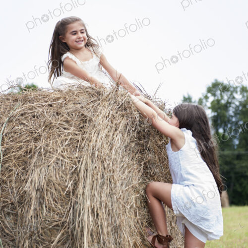 Two girls playing outdoors. Two girls playing outdoors.