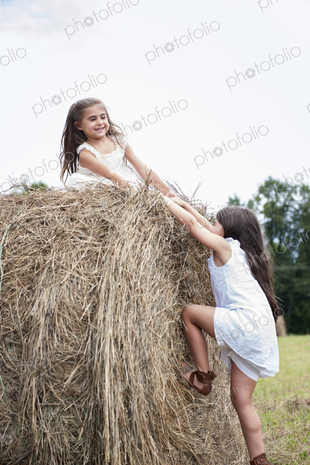 Two girls playing outdoors.