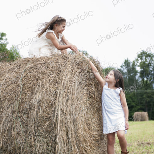 Two girls playing outdoors. Two girls playing outdoors.