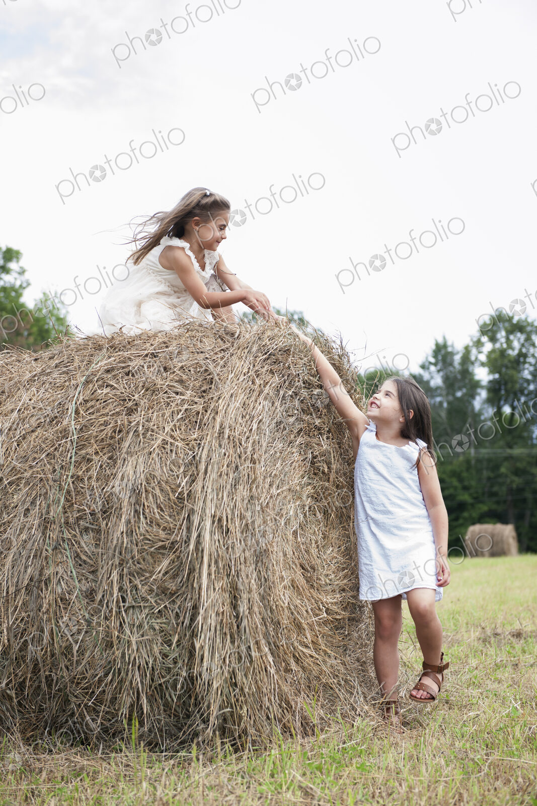 Two girls playing outdoors.