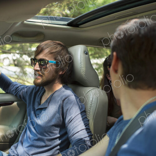 Two people in a car, passenger and driver. Two people in a car, passenger and driver.