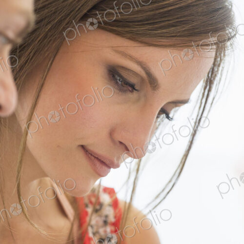 Two people, man and woman looking down. Two people, man and woman looking down.